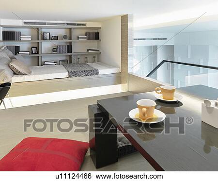 Stock Photograph - Modern loft with bed and dining table. Fotosearch