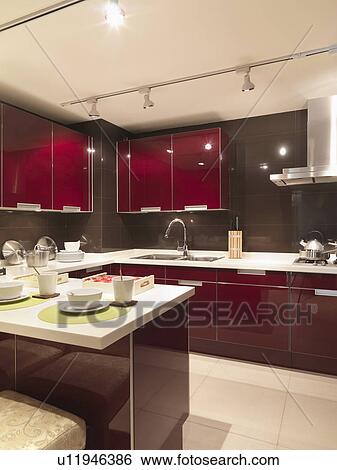 Stock Photograph - Modern red kitchen. Fotosearch