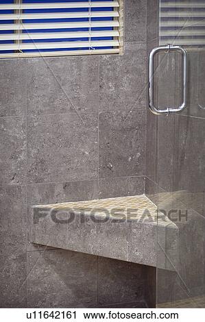 Stock Image - Mosaic tile shelf in shower. Fotosearch