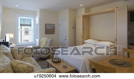 Picture - Murphy bed in studio apartment. Fotosearch