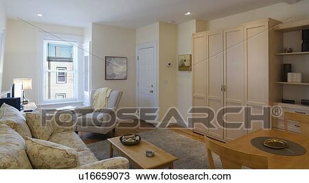Stock Image - Murphy bed in studio apartment. Fotosearch