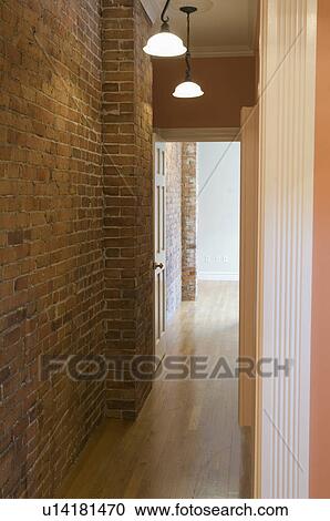 Stock Image - Narrow hallway with hardwood floor. Fotosearch