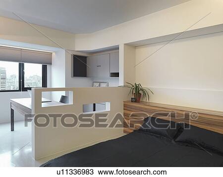 Partial wall separating home office from bedroom View Large Photo Image Stock Image - Partial wall separating home office from bedroom. Fotosearch