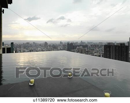 Patio and reflection pool overlooking city View Large Photo Image Stock Image - Patio and reflection pool overlooking city. Fotosearch