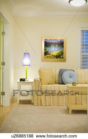 Purple lamp on end table near yellow and blue striped sofa View Large Photo Image Stock Photo - Purple lamp on end table near yellow and blue striped sofa. Fotosearch