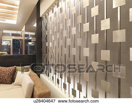 Stock Photo - Recessed lights behind decorative bars on wall. Fotosearch