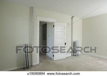 Room in empty apartment with carpet and a heater View Large Photo Image Picture - Room in empty apartment with carpet and a heater. Fotosearch