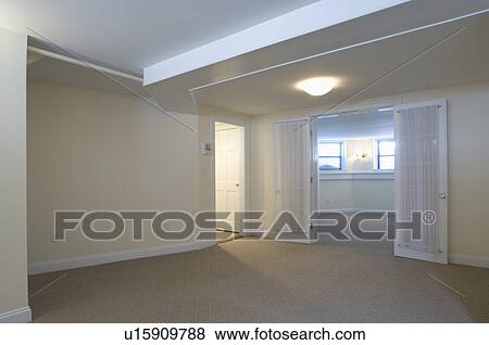 Room in empty apartment with carpeting View Large Photo Image Stock Photo - Room in empty apartment with carpeting. Fotosearch