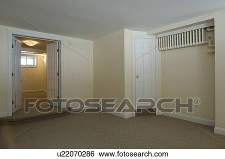 Stock Photograph - Room in empty apartment with carpeting. Fotosearch