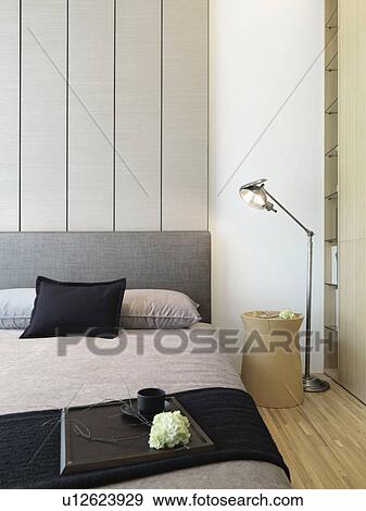 Serving tray on foot of modern bed View Large Photo Image Stock Photo - Serving tray on foot of modern bed. Fotosearch