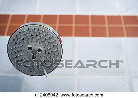 Showerhead in blue and orange tiled shower View Large Photo Image Stock Image - Showerhead in blue and orange tiled shower. Fotosearch