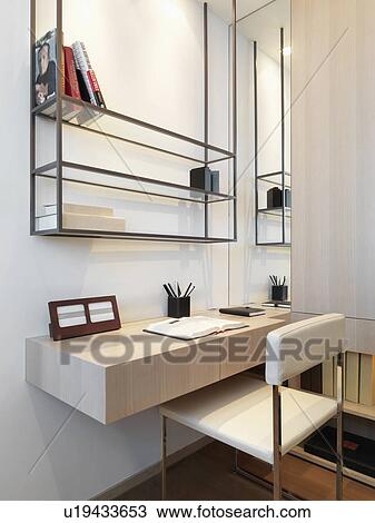 Stock Image - Small desk in modern home. Fotosearch