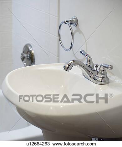 Stock Image - Small white pedestal sink. Fotosearch