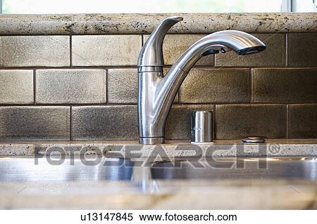 Stainless steel kitchen faucet View Large Photo Image Stock Photography - Stainless steel kitchen faucet. Fotosearch