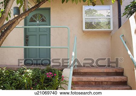 Stock Image - Steps and front patio outside apartment home. Fotosearch