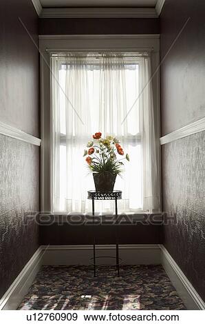 Stock Photo - Table with flowers in front of window. Fotosearch