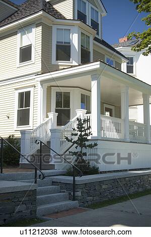 Traditional home with large front porch View Large Photo Image Stock Photo - Traditional home with large front porch. Fotosearch