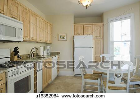 Traditional kitchen with light colored cabinets View Large Photo Image Picture - Traditional kitchen with light colored cabinets. Fotosearch