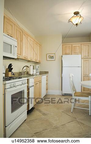 Traditional Kitchen With Light Colored Cabinets Stock Photo