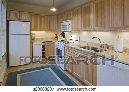 Stock Photo - Traditional kitchen with light colored cabinets. Fotosearch
