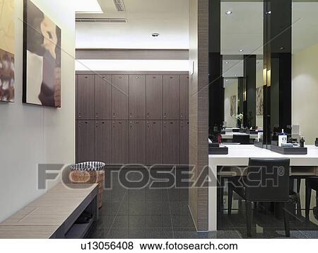 Stock Photo - Vanity and bench in locker room. Fotosearch