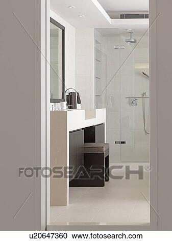 Stock Image - Vanity between sinks in modern bathroom. Fotosearch