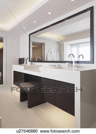 Vanity between sinks in modern bathroom View Large Photo Image Stock Image - Vanity between sinks in modern bathroom. Fotosearch
