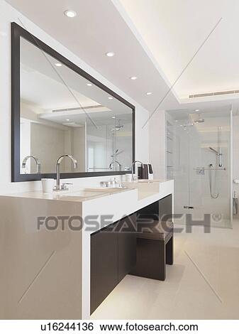 Vanity between sinks in modern bathroom View Large Photo Image Stock Photograph - Vanity between sinks in modern bathroom. Fotosearch