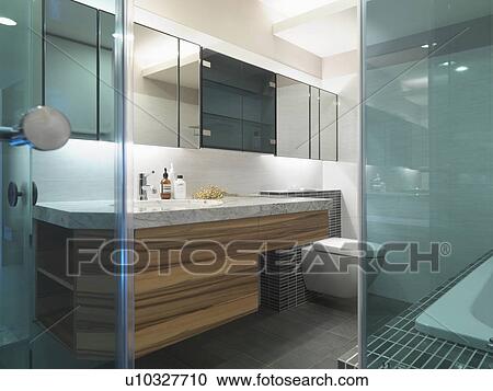 View of modern bathroom from inside glass shower View Large Photo Image Stock Image - View of modern bathroom from inside glass shower. Fotosearch