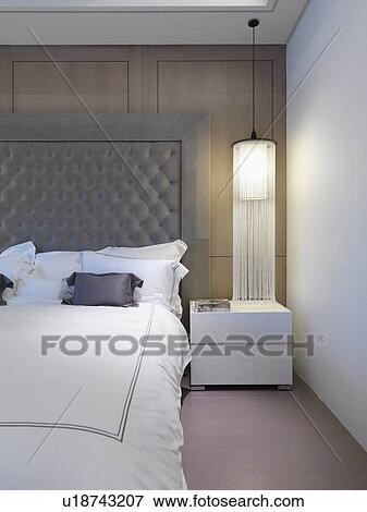 White bed with elegant headboard View Large Photo Image Stock Photo - White bed with elegant headboard. Fotosearch
