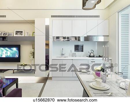 White kitchen and dining area in modern home View Large Photo Image Stock Image - White kitchen and dining area in modern home. Fotosearch