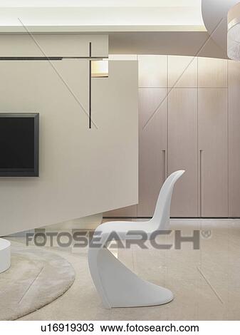 Stock Image - White modern chair in living room. Fotosearch