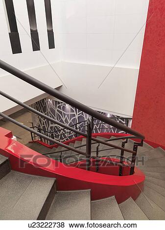 Winding red staircase with handrail View Large Photo Image Stock Photo - Winding red staircase with handrail. Fotosearch
