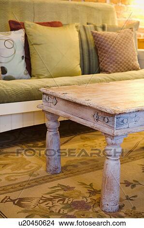 Picture - Wooden coffee table and futon. Fotosearch