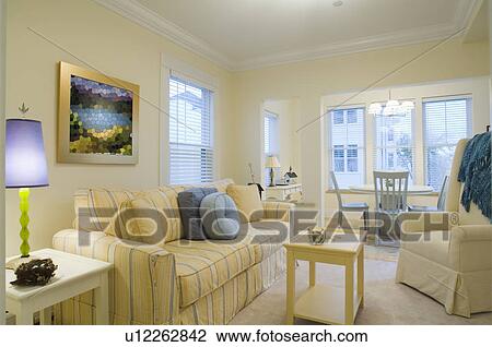 Yellow living room with dining nook View Large Photo Image Stock Image - Yellow living room with dining nook. Fotosearch