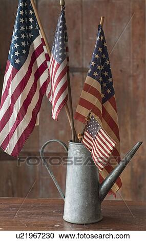 American flags in watering can View Large Photo Image Stock Image - American flags in watering can. Fotosearch