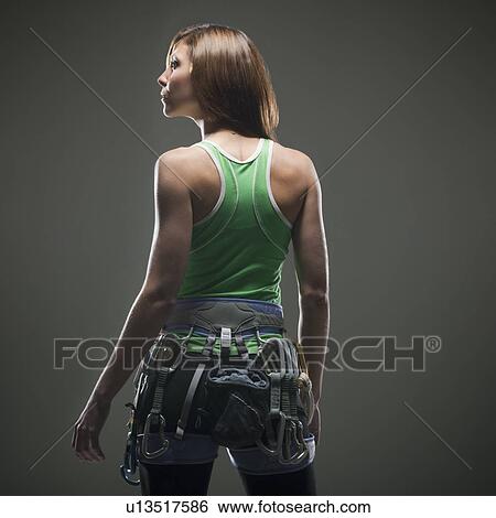 Back view of woman with climbing gear View Large Photo Image Stock Photograph - Back view of woman with climbing gear. Fotosearch