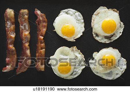 Stock Image - Bacon and eggs. Fotosearch