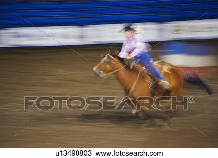 Stock Image - Barrel racing. Fotosearch
