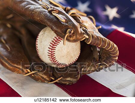 Stock Image - Baseball and American flag. Fotosearch