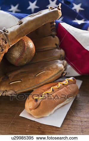 Stock Photography - Baseball glove hotdog and American flag. Fotosearch