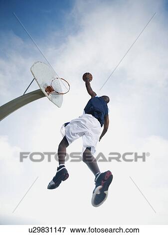 Stock Photo - Basketball player. Fotosearch