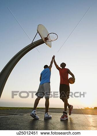 Stock Image - Basketball players. Fotosearch