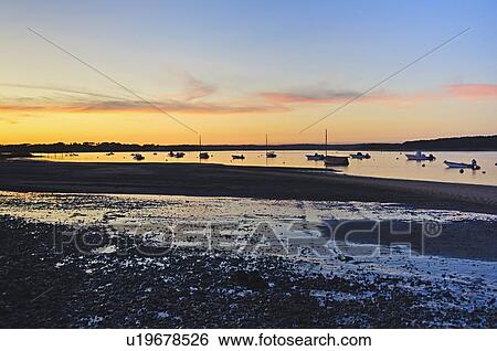 Stock Photograph - Beach at sunset. Fotosearch
