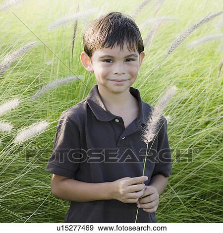 Stock Photo - Boy in grass. Fotosearch