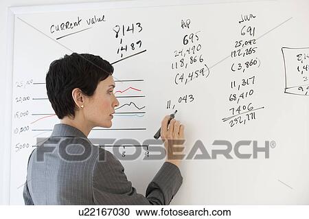 Businesswoman writing on white board View Large Photo Image Stock Image - Businesswoman writing on white board. Fotosearch