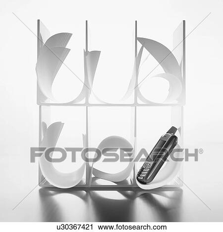 Stock Image - Cell phone and paper. Fotosearch