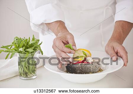 Chef preparing fish View Large Photo Image Stock Photo - Chef preparing fish. Fotosearch