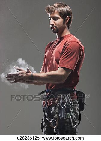 Climber putting chalk on hands View Large Photo Image Stock Photography - Climber putting chalk on hands. Fotosearch
