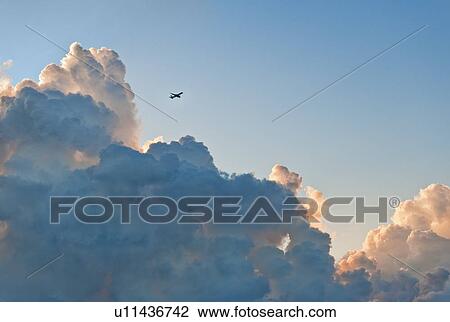 Clouds and airplane View Large Photo Image Stock Image - Clouds and airplane. Fotosearch